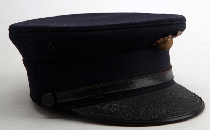 USMC 1895-1897 SPAN-AM WAR PILLBOX HAT: Hat features an EGA with longitude and latitude lines. Leather visor has heavy crazing. Inner liner is detached at various places.