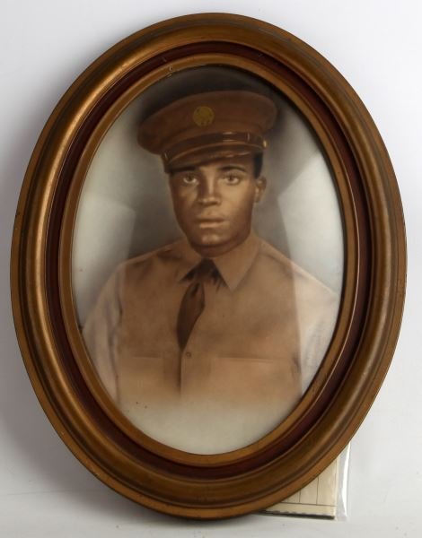 WWII BLACK SERVICEMAN PORTRAIT NAMED WITH PAPERS: Convex framed portrait of WWII African American serviceman Sergeant Daniel J Starks of 4216th Quartermaster Service Company. Copy of Honorable Discharge and Service record indicate Starks was from Mad