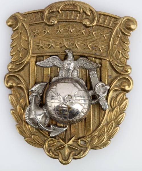 USMC SHAKO PLATE WITH SILVER EGA: This United States Marine Corps shako helmet plate with silver EGA. Measures approximately 2.75 inches tall and 2.25 inches at it's widest point. Overall in good condition.