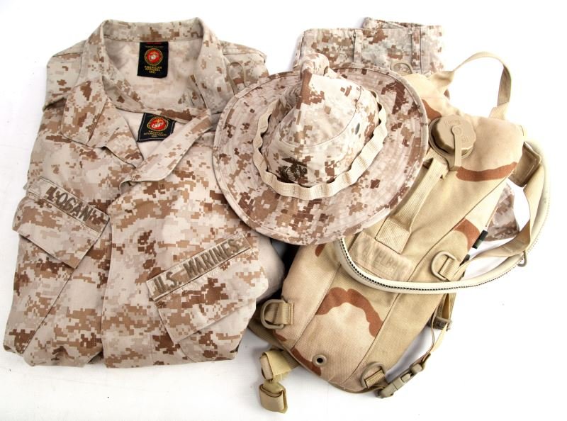 USMC TUNICS TROUSERS BOONIE HAT AND CAMELBAK: This lot includes two named tunics one to Logan one to Williams, one pair of trousers named to Logan. One boonie cap, and one CamelBak water holder.