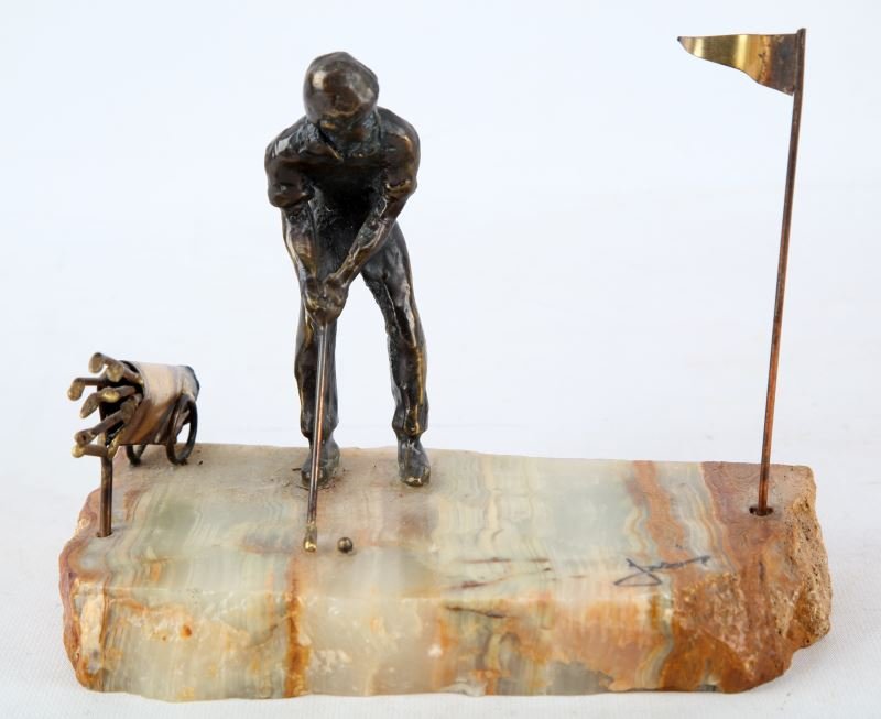 VINTAGE BRONZE ART DECO GOLFER SCULPTURE: Signed bronze statue of a golfer putting with his golf bag behind him. Measures 6.5 inches in height. Unidentified signature at bottom right of stone base.
