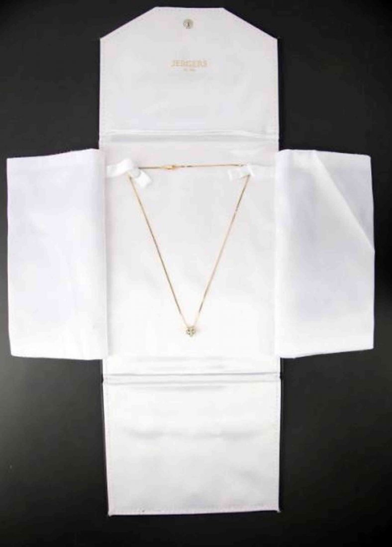 LADIES 14K YELLOW DIAMOND PENDANT: A little longer than choker length, perfect for open collar, this diamond pendant setting contains five round full cut diamonds, four weighing approximately .11ct each and one weighing approximately .