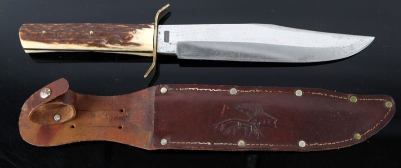 ORIGINAL BOWIE KNIFE SOLINGEN GERMANY: Vintage knife marked Original Bowie Knife, Solingen, Germany. 8 inch clip point blade, with stag handles, and leather scabbard. Some pitting damage to blade, otherwise good condition.