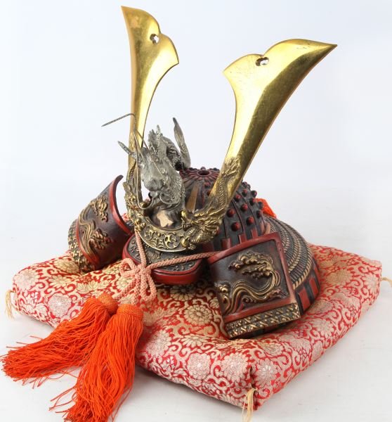 REPRODUCTION BRASS BRONZE MIXED SAMURAI HELMET: Reproduction Samurai helmet made of brass, bronze, and iron comes with a display pillow. Dragon and Kuwagata are screwed in pieces for the helmet. Helmet comes in it's original box and is believed to 