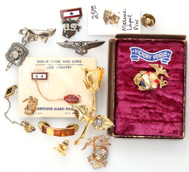 WWII USMC MARINE SWEETHEART BADGE COLLECTION: Variety lot of all USMC mostly WWII, some later sweetheart badges, including a rare Trifari sterling and gold plate EGA, two items are in original packaging, son in service, 1 1/2 inch sterling wings,