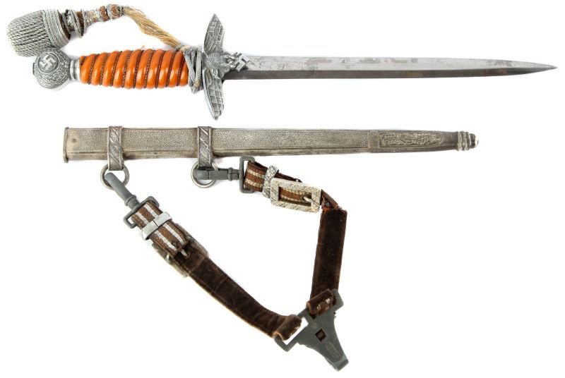 WWII GERMAN 2ND MODEL LUFTWAFFE DAGGER TIGER: WWII German Second Model Luftwaffe dress dagger, maker marked Tiger, Solingen, complete with hanger and portepee. Light oxidization and scabbard wear to bladegrip and fittings very good. Scabbard is f