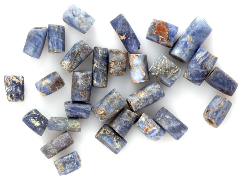 28 PRECOLUMBIAN SODALITE BEADS BOLIVIA: Group of 28 Pre-Columbian sodalite beads. Possibly from the Tiwanaku culture of Lake Titicaca, Bolivia. Found insitu by prominent collector and scholar. Beads feature burial patina, and some have calc