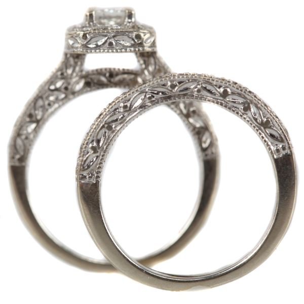 LADIES 14KT WHITE GOLD DIAMOND 2 PIECE BRIDAL SET: Cast replica of old world engraving styles; top section of engagement ring is soft-cornered square measuring 8.25 x 8.25mm, containing in center on princess cut diamond weight .25cts, graded H-SI1, su