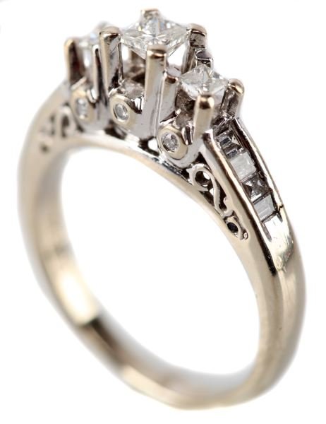 LADIES 14KT WHT GOLD PRINCESS CUT DIAMOND RING: Higher profile three stone tiered design, containing in center one princess cut diamond measuring 3.3x3.3 mm, on each side of center stone one princess cut diamond, each 2.35mm square. On front and ba