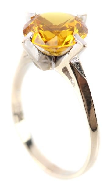 LADIES 14KT WHT GOLD GOLDEN TOURMALINE RING: Heavyweight, one piece solitaire mounting with four geometric prongs containing one round golden tourmaline measuring 10.3mm in diameter and 6.mm deep. Bright color with vitreous finish. Size: 8.5 Wei