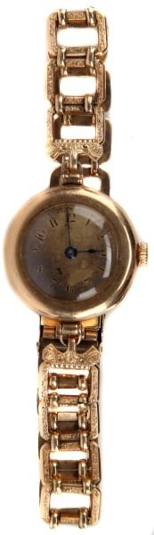LADIES VINTAGE14KT YG GRUEN WATCH W/GF BRACELET: Measuring 23mm in diameter, 7.5mm thick, Gruen 15jewel manual movement, estimated date 1935-1940. Gold colored gold filled dial discolored. 14kt yellow gold filled bracelet, with folding clasp, manufa