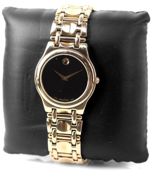 MENS MOVADO 9874 MUSEUM GOLD TONE SWISS WATCH: Classic Movado styling; gold tone case and matching bracelet with hidden clasp, synthetic crystal, ETA quartz movement. Black dial with gold hands. Weight: 83.0 Condition: Very good; runs, no implied