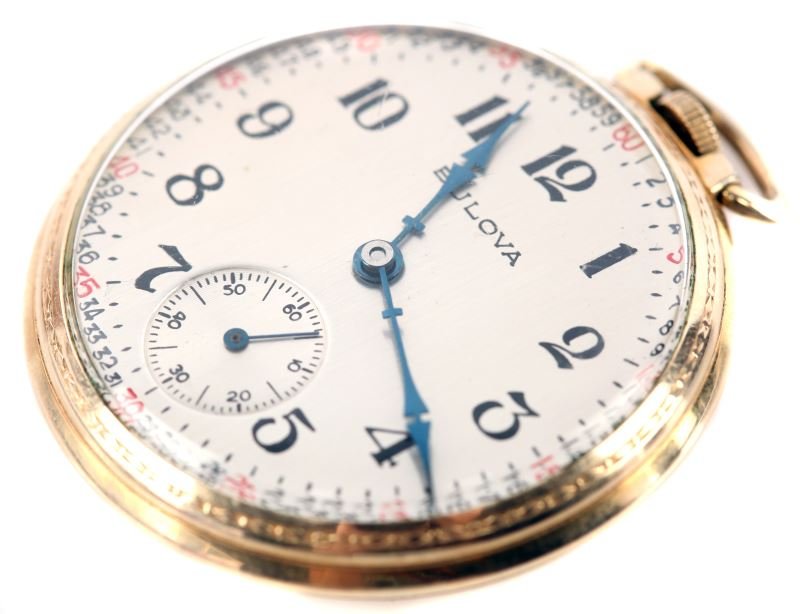 VINTAGE BULOVA 10K YG ROLLED GOLD POCKET WATCH: Measuring 43mm in diameter, 10.5mm thick, open face dress Bulova, 17 jewel manual wind, mechanical movement, with L9 code on case and movement, dating piece to 1959. Silver color dial, Arabic numerals