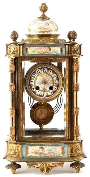 TIFFANY & CO. 19TH CENTURY FRENCH MANTLE CLOCK: Gilt, porcelain and hand-painted glass chiming mantle clock standing 14 inches tall and 7 inches wide. Hand-painted dial with Cherub is marked "Tiffany & Co." and "Made in France". Top and bottom case