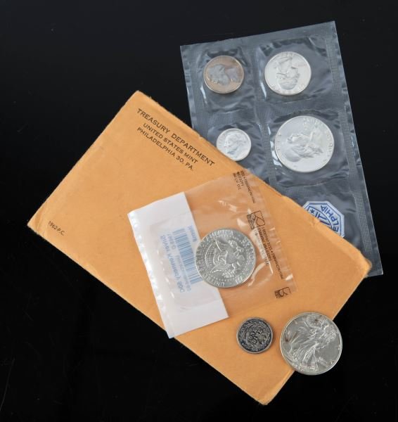 BU WALKING LIBERTY KENNEDY HALF 1962 SET F BARBER: Includes 1945 D walker, nice BU, 1969 D Littleton package 40% Kennedy half dollar, 1962 as issued by the Mint proof set, and a 1914 D full Liberty F/VF Barber dime,