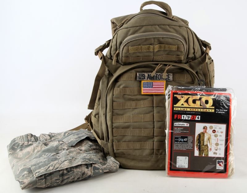 USAF MISC GEAR BACKPACK TROUSERS & UNDER SHIRT: This United States Air Force lot includes a XGO flame retardant shirt size large. A pair of digital Air Force trousers size 34R, and a 5.11 Tactical Series back pack. All three items are in good to ve