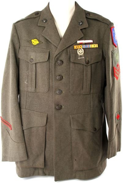 WWII USMC PARAMARINE MEDIC TUNIC: WWII USMC Paramarine medic's tunic. Red bordered paramarine patch, medic patch, early rifle expert badge, 2 globes, 5 service ribbons with 3 stars on Pacific, and ruptured duck. Likely enhanced with p