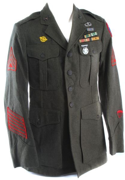 WWII USMC PARAMARINE TUNIC: WWII USMC Paramarine tunic. Patch with "blood border", sgt chevrons, two 12 year service stripes, parachute pin, 6 service stripes, occupation, and ruptured duck. Excellent condition. Likely enhanced 