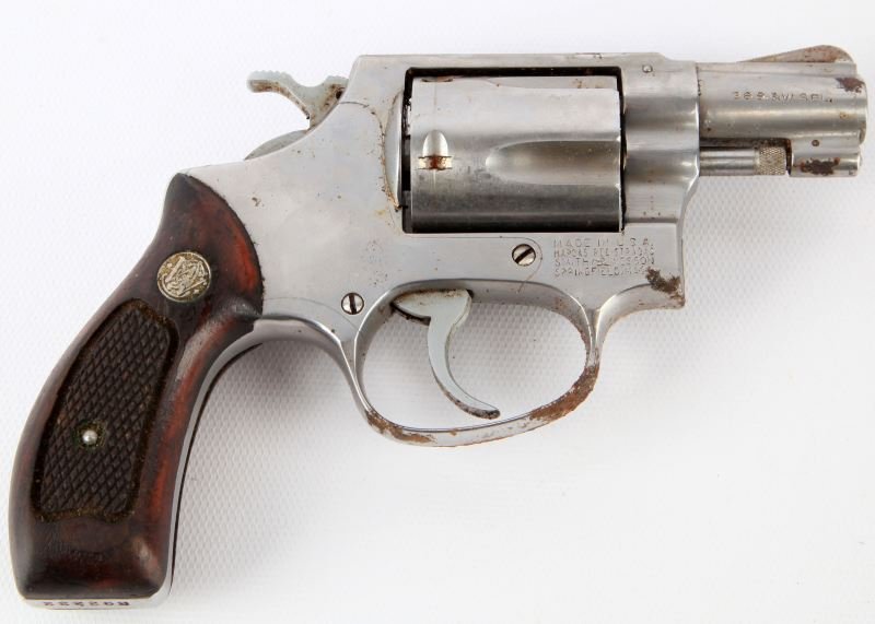 SMITH & WESSON MODEL 60 REVOLVER .38 SPL: Smith & Wesson Model 60 revolver. Stainless steel finish shows severe corrosion on one side, but bore remains good, and gun appears functional. Overall fair condition. Caliber: .38 SPL Serial #: R9222