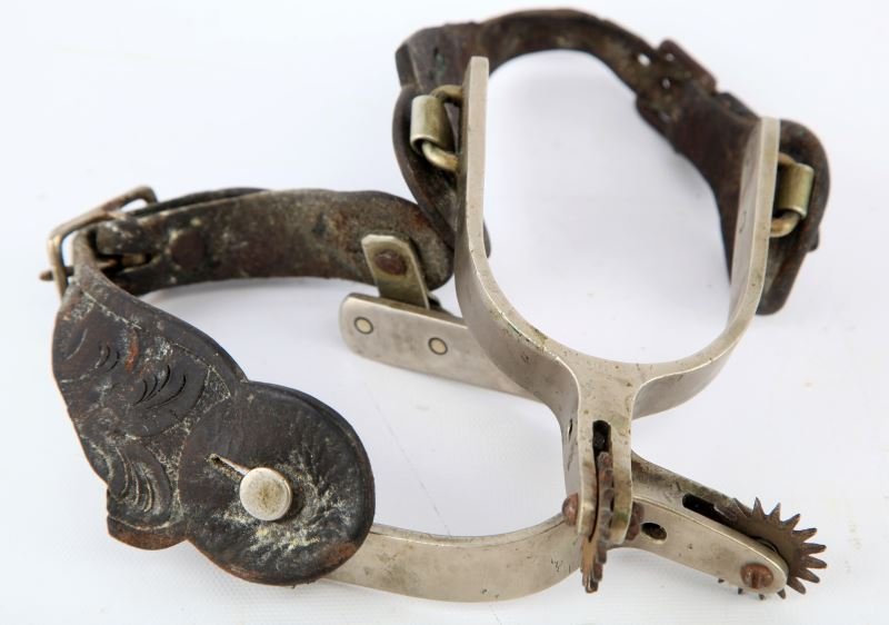 DON RICARDO STAMPED SPURS GOOD LEATHER: An old repair on one spur obscures the Don Ricardo mark, early pair with good leather, pretty heavy service wear to the leather.