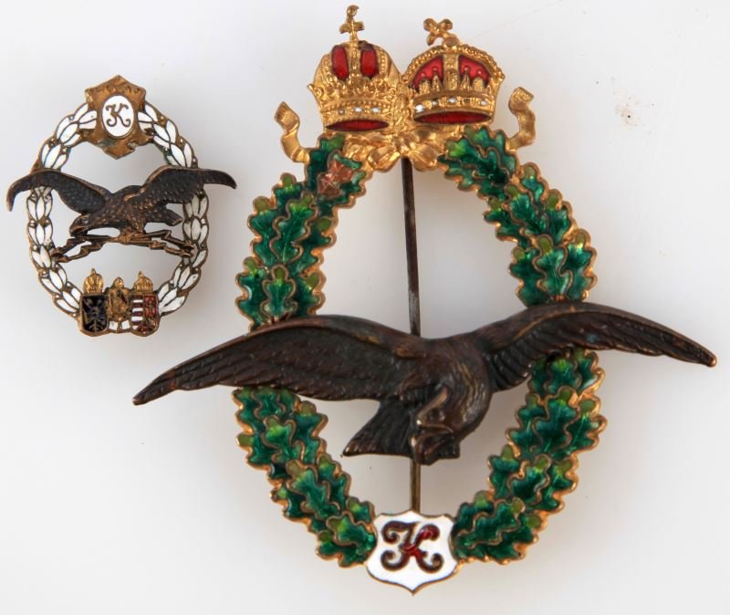 AUSTRIAN WWII AIR FORCE GROUP OF MEDALS: Medals included are 1 enameled miniature radio operator badge (pin missing) and 1 late WWI "K" stands for Kaiser Karl, Pilot badge. Overall in good to very good condition. This lot has a reserve.