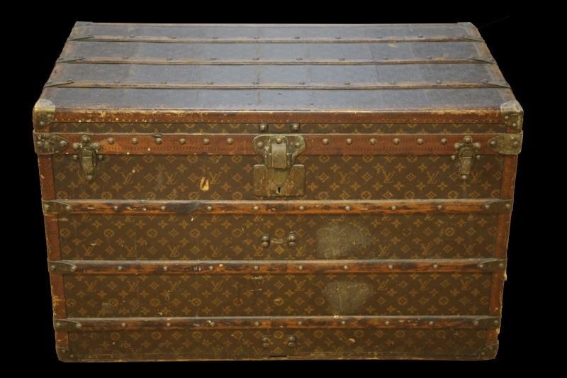 ORIGINAL UNRESTORED LOUIS VUITTON FLAT TOP TRUNK: Full size trunk measures 36 by 21 by 23 inches. Beige and brown Daimer canvas with signature "LV" plus quatrefoils and flowers. Wood, leather and brass trimmed. All tacks, leather trim, locks and hasp