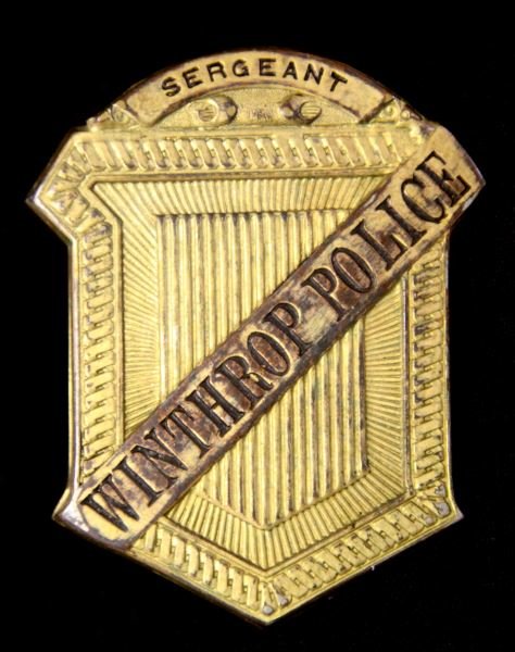 ANTIQUE WINTHROP POLICE SERGEANT RADIATOR BADGE: Plated stamped hollow back police from Winthrop Ma. police dept. Vertical pin back. 3 inches tall by 2.25 wide. Good to very good overall condition with loss of plating commensurate with age. From the