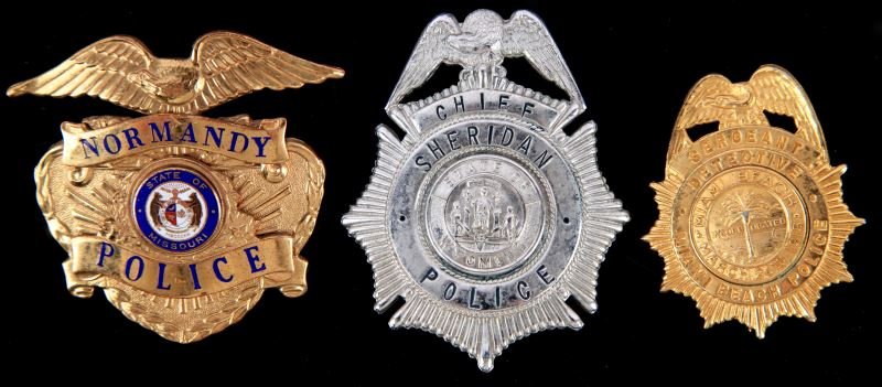 OBSOLETE POLICE BADGE LOT WYOMING MIAMI & NORMANDY: Three badges include, Miami Beach, Florida, Detective Sergeant, two inches, second one is Sheridan, Wyoming Police Chief , three inches, the last a Normandy, Missouri Police cap badge, all in very goo