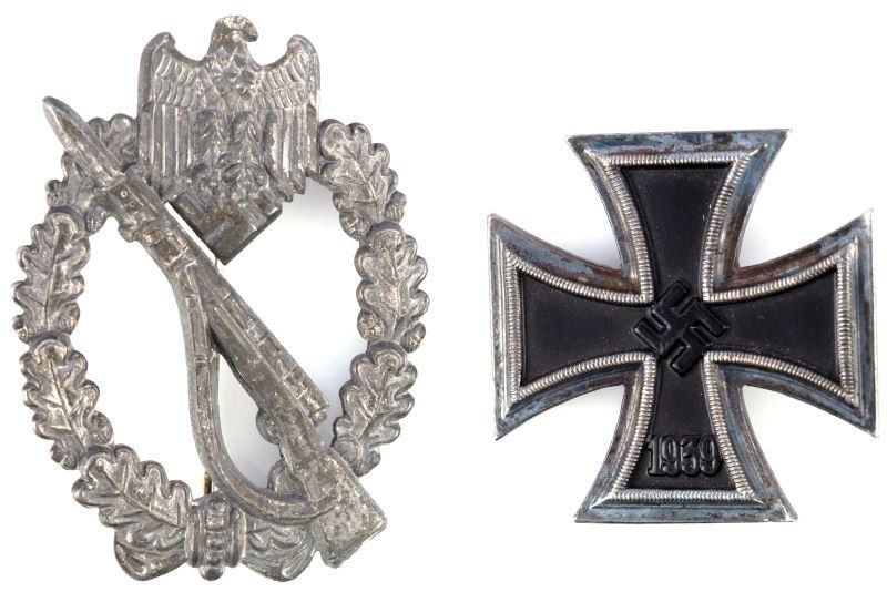 WWII GERMAN SPURIOUS MEDALS EKI & ASSAULT BADGE: Spurious EKI (Iron Cross First Class) 180 degree pin, no markings, solid construction, blue tone. Silver Infantry Assault Badge in silver, 1800 degree pin, no maker's mark, heavy wear and pitting. Ove