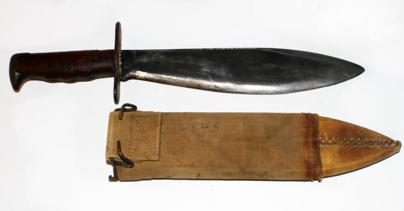 U.S. 1917 MODEL BOLO KNIFE WITH RAWHIDE SCABBARD: Nice condition Bolo with interesting rawhide repair to scabbard end.