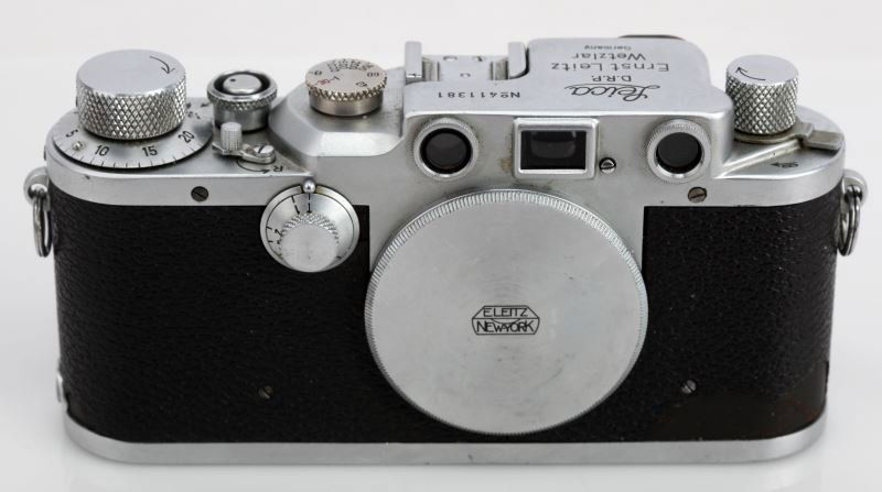 VINTAGE LEICA IIIC RANGEFINDER 35MM CAMERA: This Leica III is a range finder camera manufactured by Leica in 1946, serial number 411381. The Leica III uses a coupled range finder distinct from the viewfinder. Made in Germany (DRP). Not sure of
