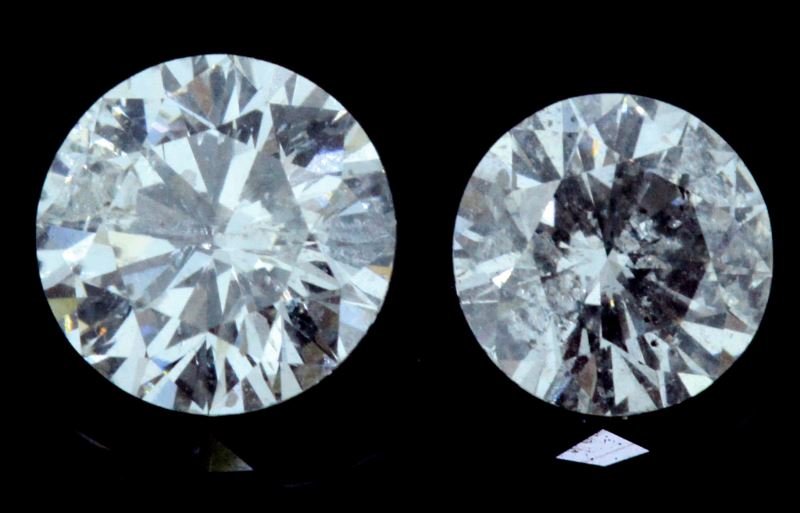 SMALL LOT TWO ROUND FULL CUT DIAMONDS .96CT TW: Two round brilliant cut diamonds; one weighs .57ct, the other weighs.39ct. Graded H-J/I1-I2, with good make. Stones face up well. Weight: .96 CT TW Condition: AS IS.
