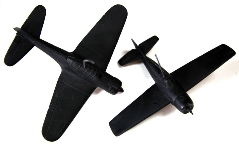 WWII US RECO MODELS A-24 DAUNTLESS & F4F-4 WILDCAT: Grouping consisting of world War II Recognition Spotter Model, United States Navy Grumman F4F-4 Wildcat. Produced by Cruver, made from Acetate, 5/1943, 5" long 6 1/2" wingspan, very good condition and