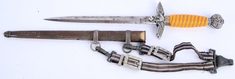 GERMAN WWII LUFTWAFFE 2ND MODEL DAGGER W/ HANGERS: Complete 2nd model German Luftwaffe dagger with hangers. Bladed is etched with Holler Solingen mark. Overall very good condition with minor surface rust to blade. Hanger clip is marked "DRGM" on back.