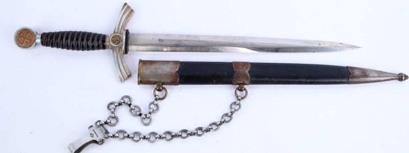 GERMAN WWII 1ST MODEL LUFTWAFFE DAGGER WITH CHAIN: A fine, true and correct 1st model Luftwaffe dagger with blue leather grip and scabbard. Blade by Ernst Pack & Sohne, also etched "Siegfried Waffen". Nice patina to parts and some minor staining to bl