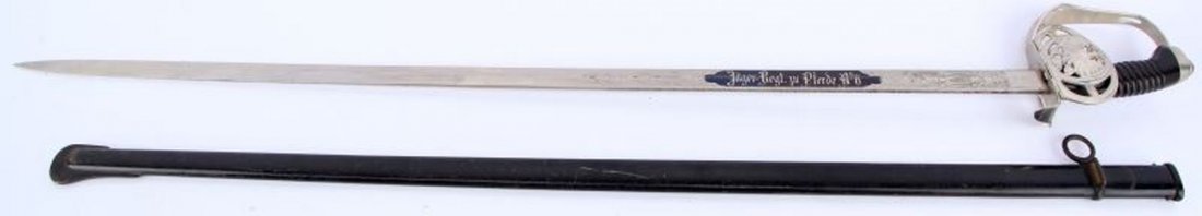 GERMAN PRUSSIAN M1889 CAVALRY OFFICER SWORD: M1889 Prussian Cavalry sword, single loop intact scabbard (before) 1907. Blade is etched on reverse with 19 cavalry men in charge and large horse head insert. Obverse has " Jager regt zu Pferde No6" i
