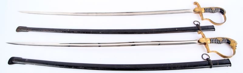 WWII THIRD REICH FIELD MARSHALL SWORD LOT OF 2: Grouping of two WWII Third Reich Field Marshall swords " Blucher" and "Wrangel" from mid 30's. Blades and wires near perfect, some mild gilt loose from both handles. This lot has a reserve.