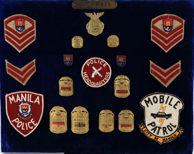 MANILA POLICE BADGES AND PATCHES COLLECTION: Collection of Phillipine police badges includes varying ranks such as Sargeant, Corporal, and detective. 18 pieces present. Overall in very good condition.