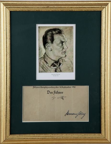 HERMANN GORING FRAMED SIGNATURE: Hermann Goring (German, 1893-1946) framed document bearing the signature of "Herman Goring" and features a secretary stamp of "Adolf Hitler". Featured in frame is a portrait of Goring Signed "K. Bauer