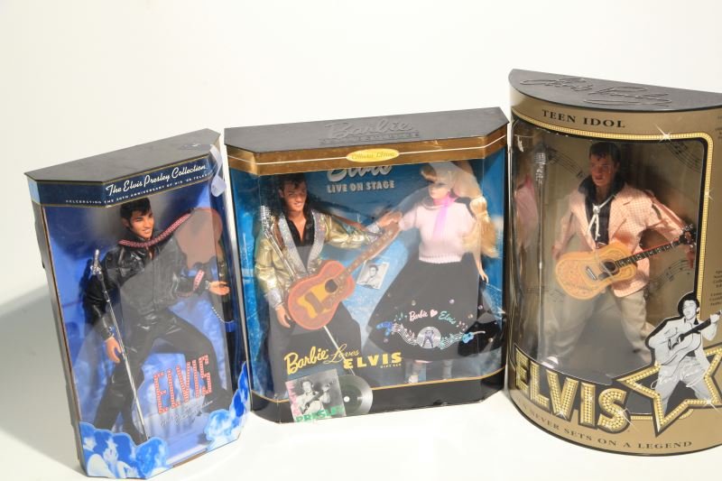 GROUP OF 3 ELVIS PRESLEY DOLLS IN BOXES: The king returns, and he's more fabulous than ever. Group includes "Teen Idol Elvis", "Elvis, from the Elvis Presley Collection", and "Barbie Loves Elvis". All dolls are in original boxes. Some wear i