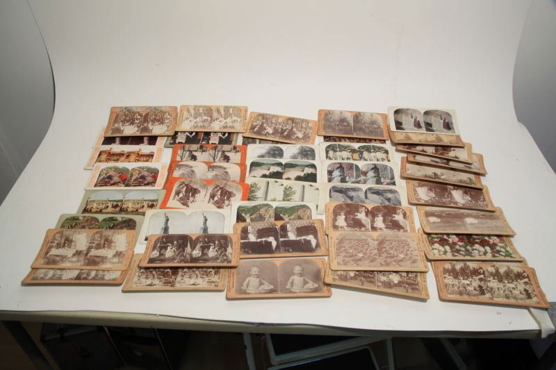 STEREOVIEW WITH SEVERAL MISCELLANEOUS CARDS: One viewfinder with 26 Keystone View Company cards, 11 cards with titles but no makers mark, 1 marked "Metropolitan Series" titled "Love Making", 1 Griffith & Griffith card, 1 Panoramic View of Calvar