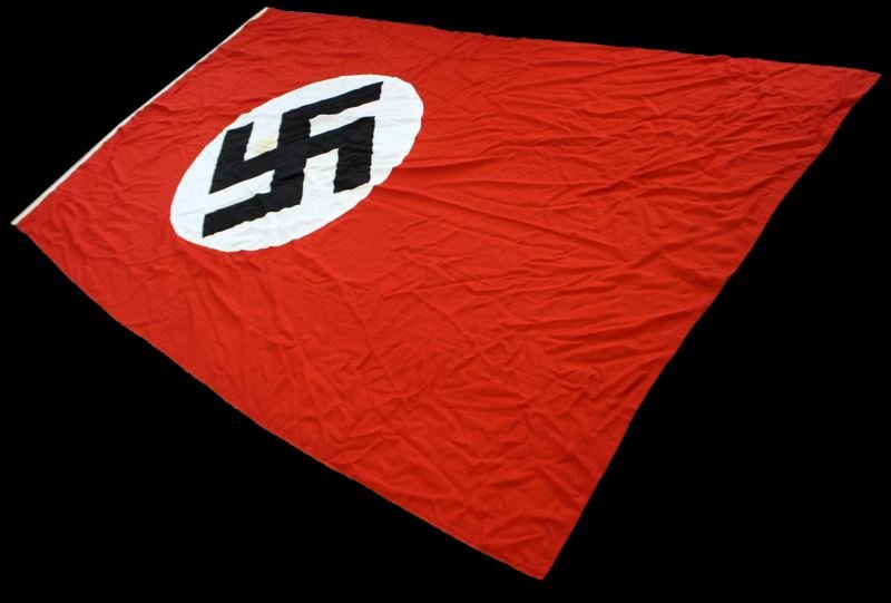 73 BY 140 INCH NAZI GERMANY NATIONAL FLAG: Nice condition high quality sewn not printed flag, slight stain within Swastika disc, hanging hooks attached with edge wind protectors, veteran bring back,