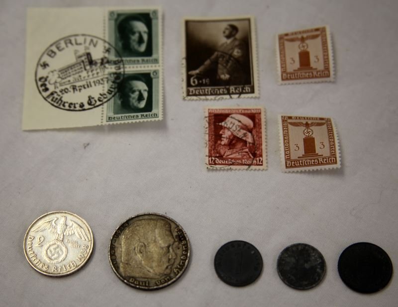 COLLECTION NAZI COINS & STAMPS ZINC COPPER SILVER: Includes near mint stamps which includes a two stamp partial plate with Third Reich cancellation, silver 1935 five mark VG, silver two marks XF, two copper one marks VF and XF, and three zinc coins.