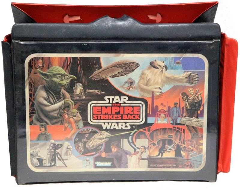 GROUP OF 11 1970'S-80'S KENNER SW ACTION FIGURES: Group includes four storm troopers, one tusken raider, the sith, empire pilot, and empire officer, and more. Includes 1977 Kenner carrying case. Some signs of play wear overall in good condition.