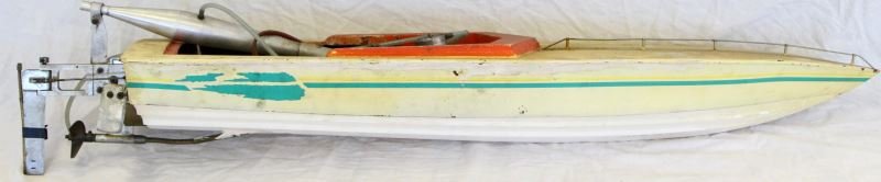 VINTAGE GAS POWERED COMPOSITE TOY BOAT ALUM. PARTS: Vintage gas-powered composite toy speed boat with aluminum parts. O.S. 4E Max .46 V marine engine. Repaired caulking to bottom and interior. Not tested. Fair to good condition. Measures 43 by 11.5 inc