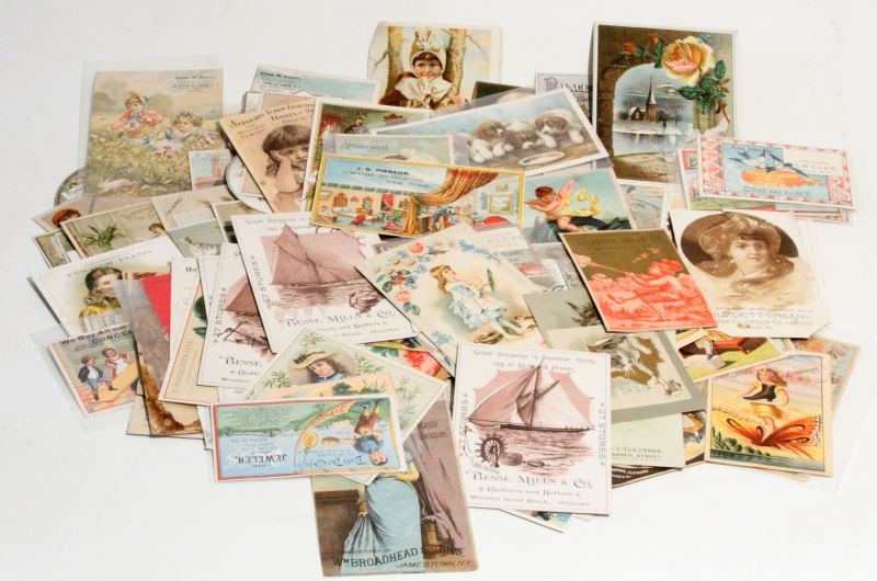 VINTAGE ADVERTISEMENT TRADE CARDS LOT OF 110: 110 Advertisement cards, includes companies like Golden Eagle Clothing store, Fischer Piano, J.N. Clothes, Hickok's Music Store, C.M. Barnes and more. Most of the card has been previously adherd and r