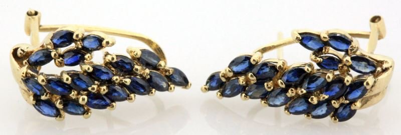 LADIES 14KT YELLOW GOLD BLUE SAPPHIRE EARRINGS: Elongated waterfall design, 23mm high, 10mm wide, each earring contains 17 matched marquise shape blue sapphires, 3.25 x 2mm, medium deep bright blue in color. Post with clip on back. Weight: 4.7g Con