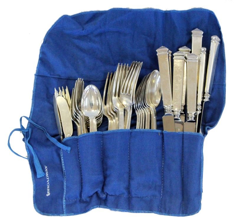 TIFFANY & CO. STERLING SILVER SILVERWARE SET FOR 8: Group includes eight knives, eight dinner forks, eight salad forks, eight teaspoons, eight dinner spoons, and two butter serving knives. Group weighs 84.85 ozt or 2640 grams. Every piece is marked Tif