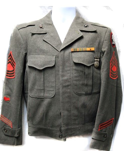USMC WWII ARCTIC EXPEDITION FORCES IKE JACKET: Carbine qualification badge, partial sterling, master sergeant, arctic expeditionary is hand embroidered, approximate size is 36, photographer striker patch, overall in good condition, slight mothing.