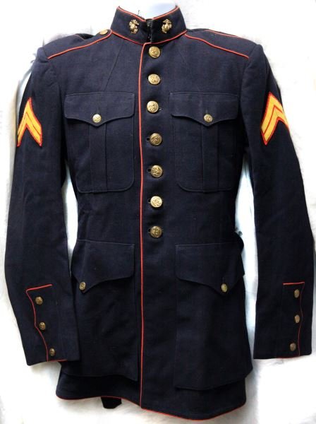 LATE WWII USMC MARINE DRESS BLUE TUNIC SIZE 38: Inside of the jacket is named to L. Wisniewski, but inside pocket has name M.L. Hamon, suggesting a ship store used purchase. Tunic includes corporal stripes and collar EGA's. Free of mothing and othe